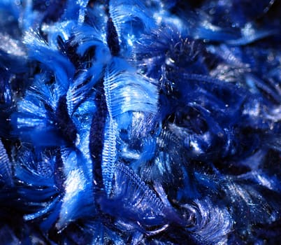 A close up photograph of blue fibres, perfect as a deep, vibrant background or abstract