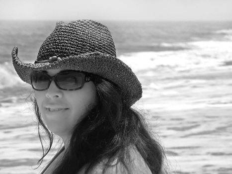 A pretty Spanish model smiling at the beach - Assateague Island, located near Ocean City, Maryland.  Plenty of copy space.