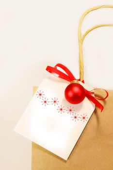 White holiday gift card with shopping bag