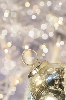Silver ball with background full of lights