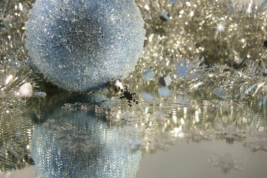 Blue ice Christmas ball with tinsel
 