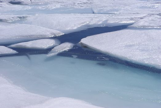 Spring ice breakup on a high Sierra lake.