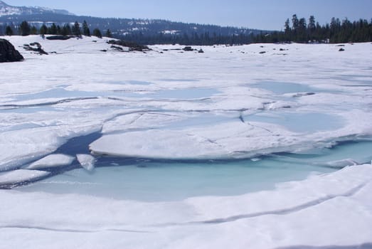 Ice breaking up on a high Sierra lake.