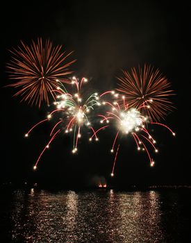 colorful sparkler-like fireworks against the dark sky
