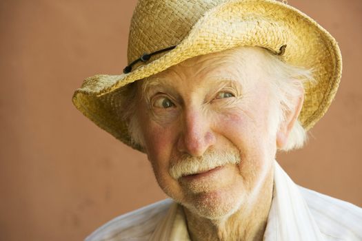Senior Citizen Man in a Straw Cowboy Hat