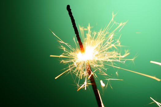 christmas sparkler on green background