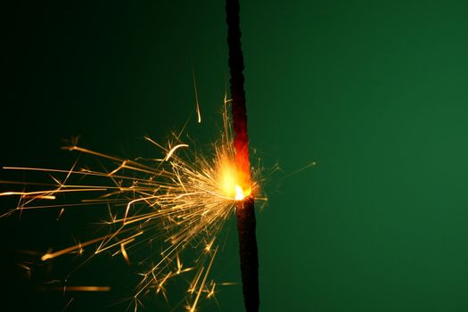 christmas sparkler on green background