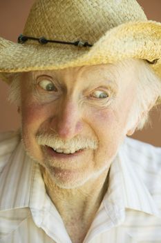 Senior Citizen Man Smiling in a Straw Cowboy Hat