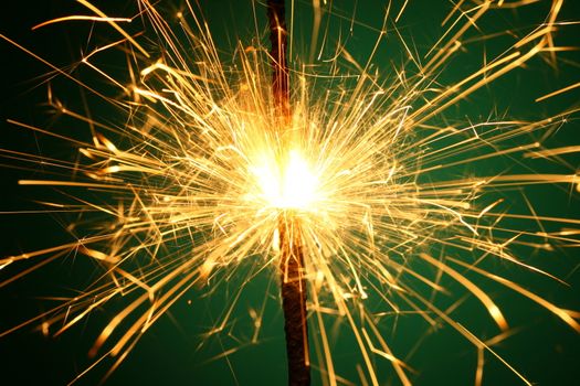 christmas sparkler on green background