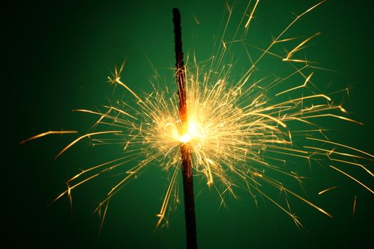 christmas sparkler on green background