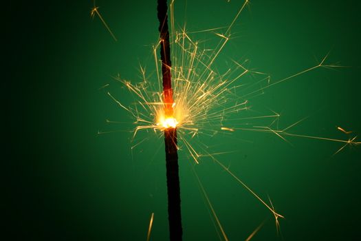 christmas sparkler on green background