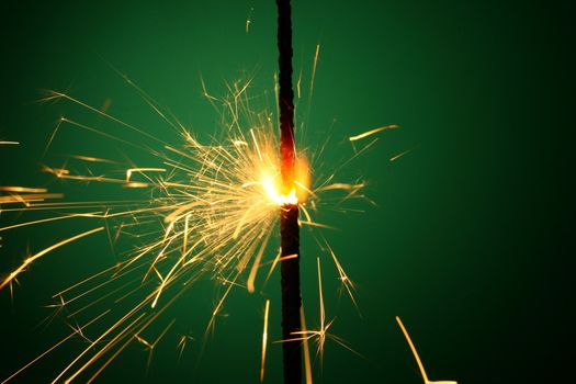 christmas sparkler on green background