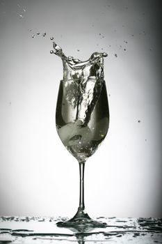 alcohol splash on gray background