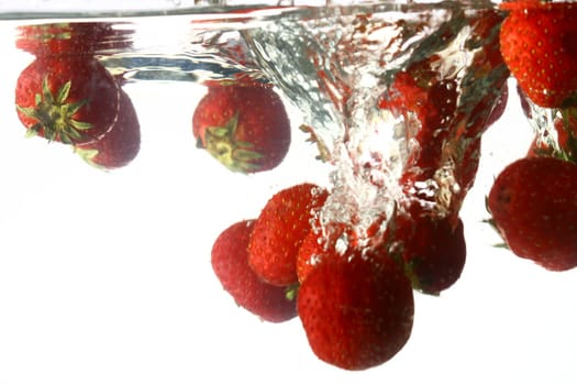 strawberry splash in water isolated on white background