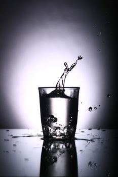 alcohol splash on gray background