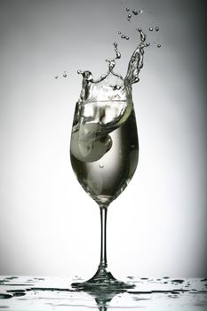 alcohol splash on gray background