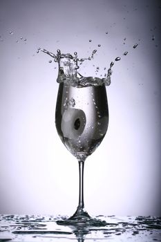alcohol splash on gray background