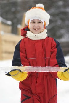 Happy girl with ice in snow suit