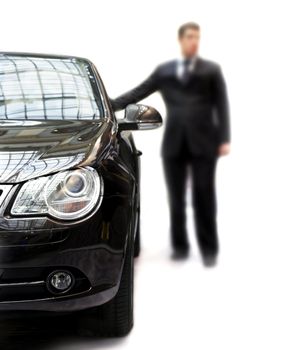 Unsharping businessman around his black car