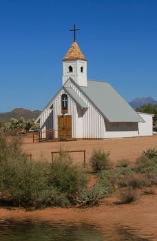 White clapboard church shimmers in the heat of the Arizona desert.