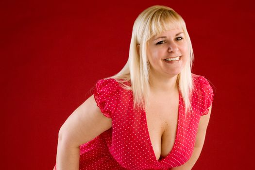 Sexy voluptuous blonde smiling