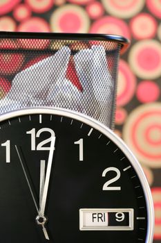 Clock showing time with waste paper basket and retro wallpaper
