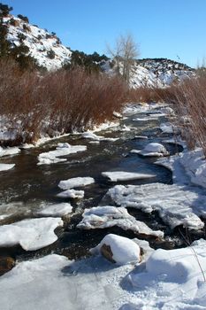 Four Mile Creek, clogged with small ice flows in the snow