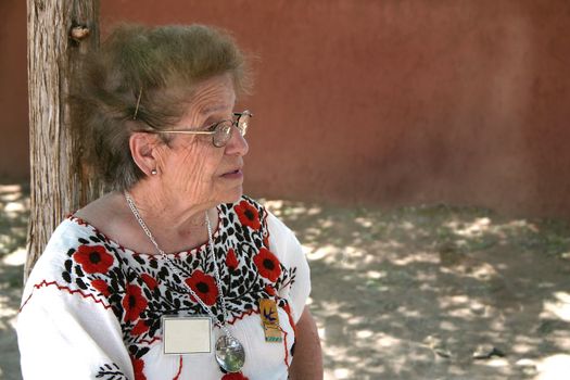 Mature volunteer tells stories of the past at centuries old hacienda in New Mexico.
