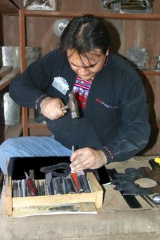 Tinsmith working on latest project