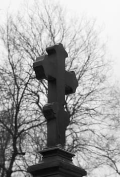 Black marble orthodoxal cross-shaped tombstone