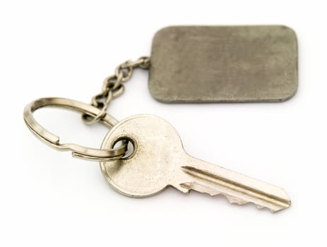 Key with trinket on a white background