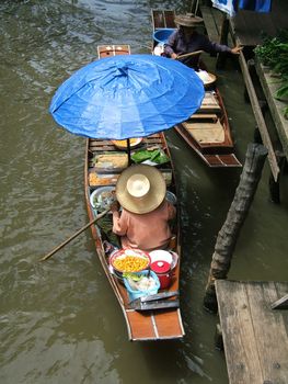 Thai woman working in floating market - Thailand - Damnoen Saduak Floating Market, near Bangkok - A famous touristic place