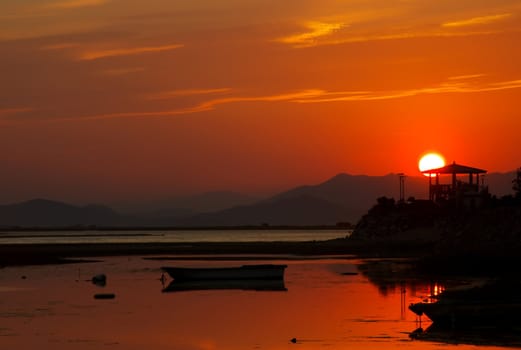 Sunset over a lagoon near Busan, South Korea.