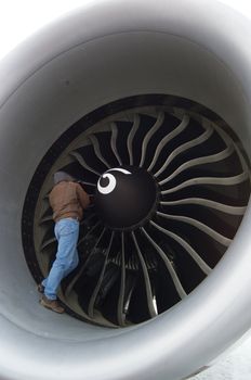 man in turbine of jet liner