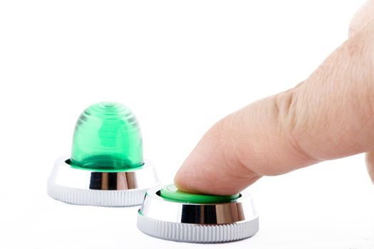 a finger pressing a green button on white background