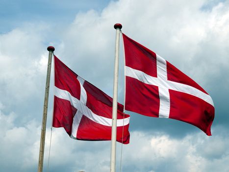 Flags of Denmark Danish blowing with sky background