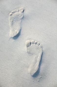 Set of footprints left in sand