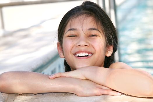 Little girl  enjoying the swimming pool