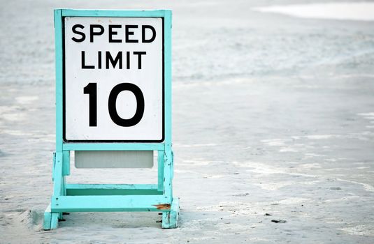 Posted speed limit sign on beach