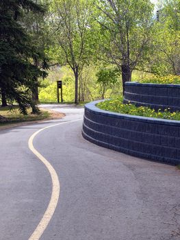 Terraced planters on the side of a walking path in the river valley.