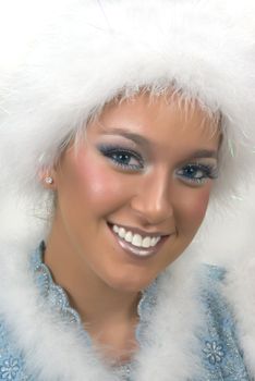 Beautiful girl with fake fur hat and a dramatic make up