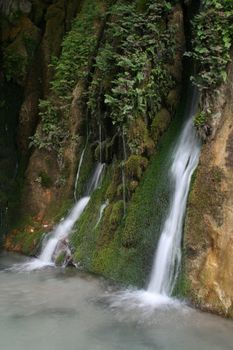 Small waterfall and stone