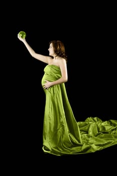 Beautiful Pregnant woman holding a Crystal Ball with a beautiful dress