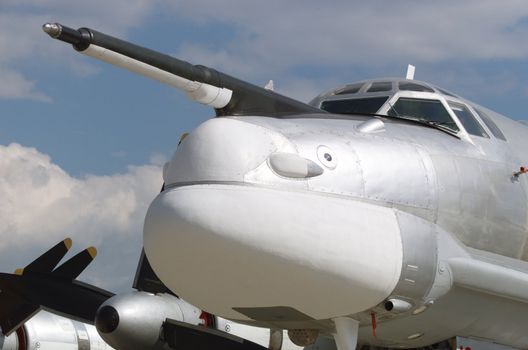 The military plane on parking at the airport.