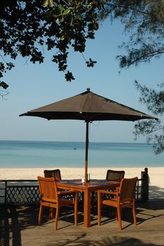 Dining table on a quiet and tranquil sunny beach