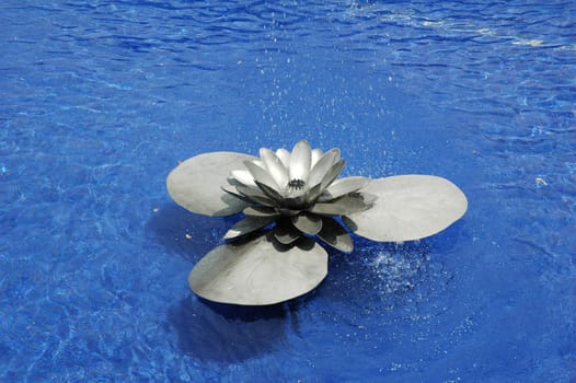 Water fountain in the shape of steel lotus flower