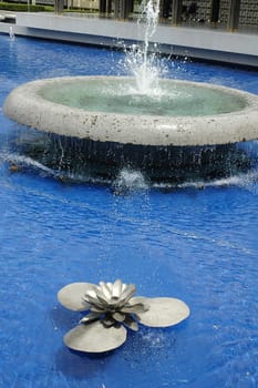 Water fountain in the shape of steel lotus flower