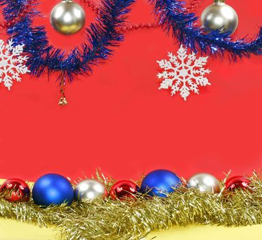 Christmas decoration: varicoloured balls and white snowflakes.