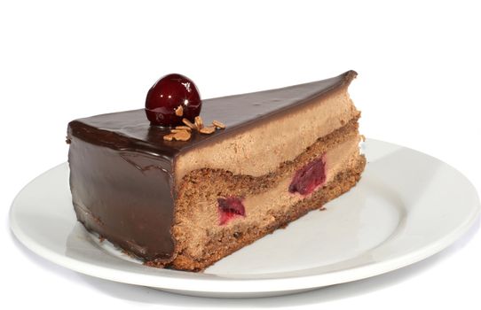 cherry cake with segment of chocolate and bit of the almond nut