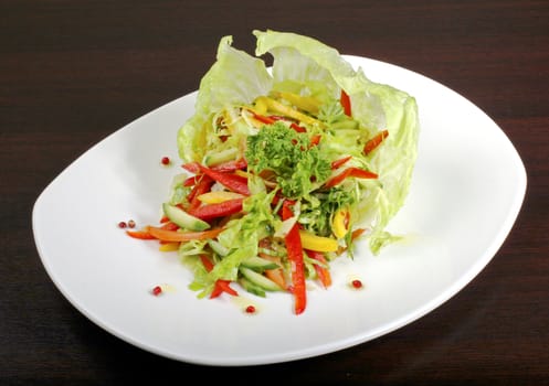 Italian salad "Iceberg" with vegetable: pepper, cabbage, cucumber, tomato